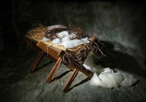 7751101-the-story-of-christmas-metaphor-represented-by-a-manger-and-crown-of-thorns